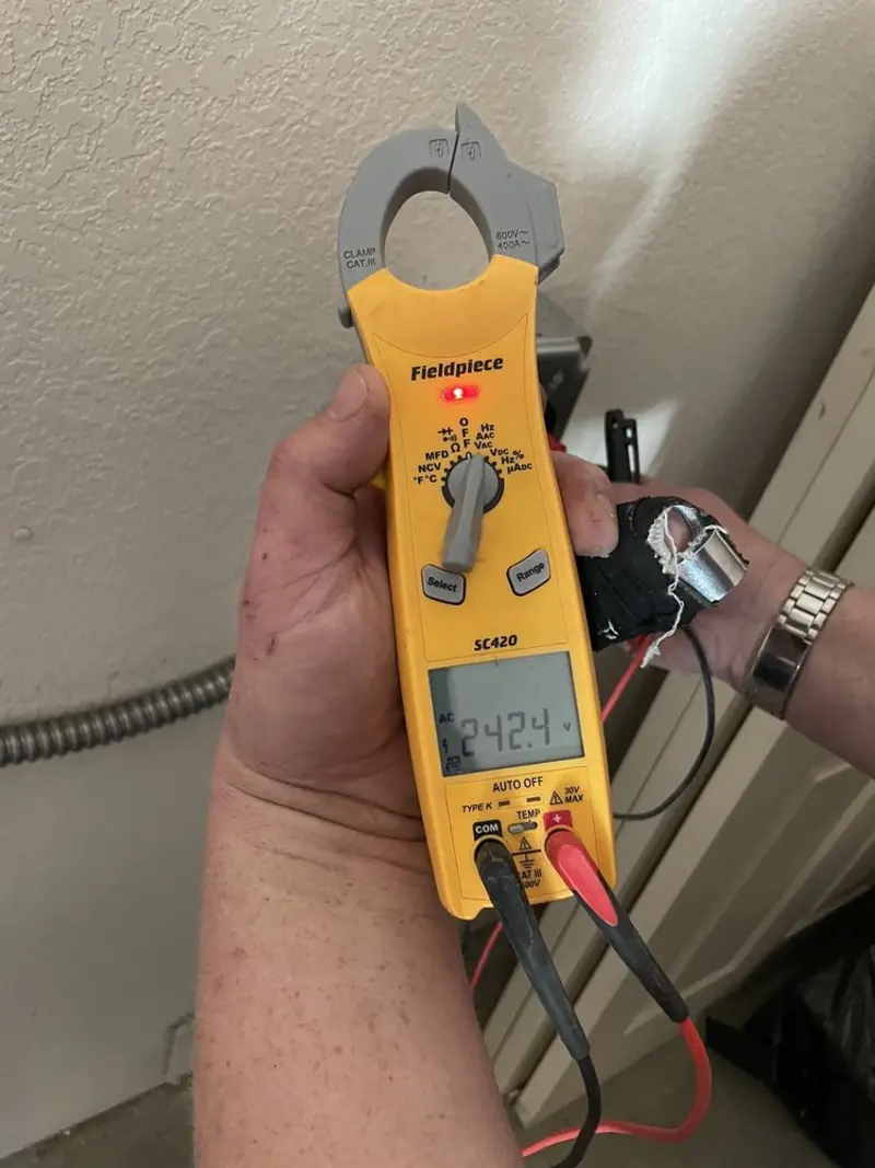 Voltage testing with clamp meter during Outlet Installation in Florham Park